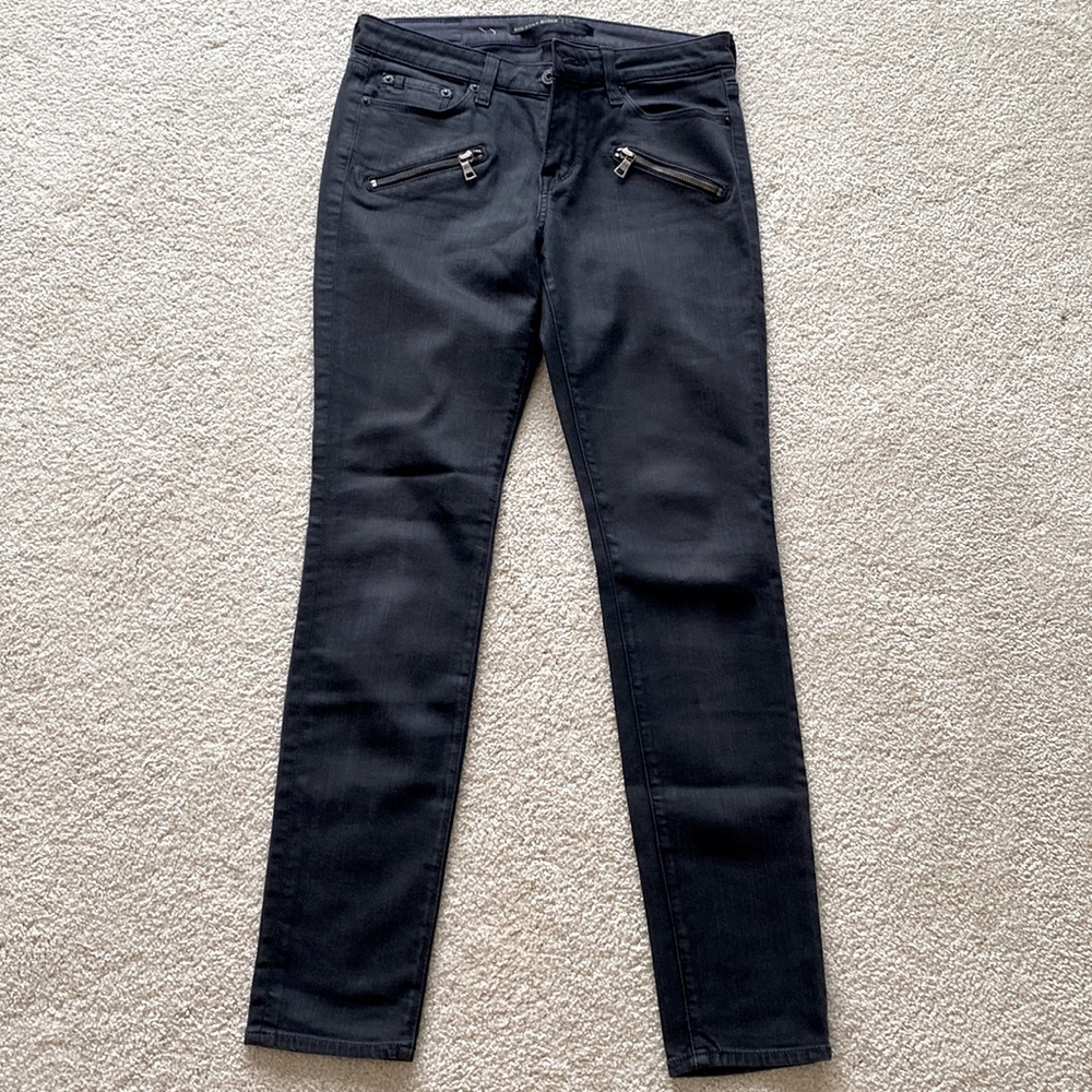 Black, coated jeans.  Excellent condition.
